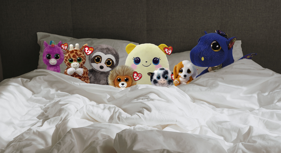 Variety of beanies in a bed