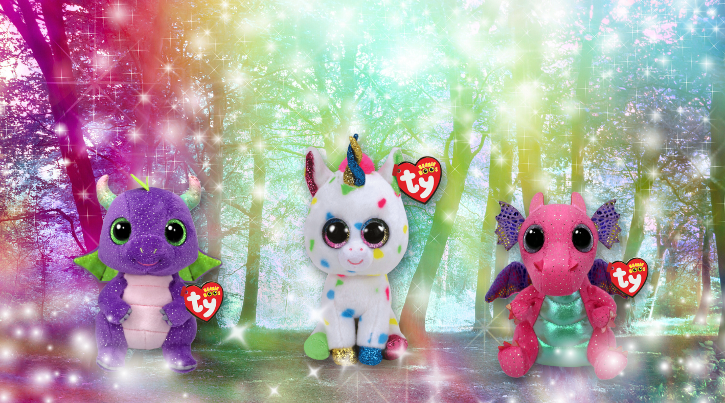 Image of two dragons and one unicorn in the middle with sparkles around it.